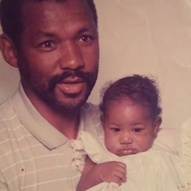 A man holds a baby.